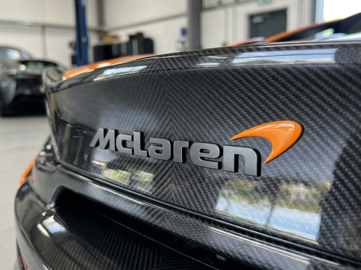 McLaren logo swoosh brand emblem